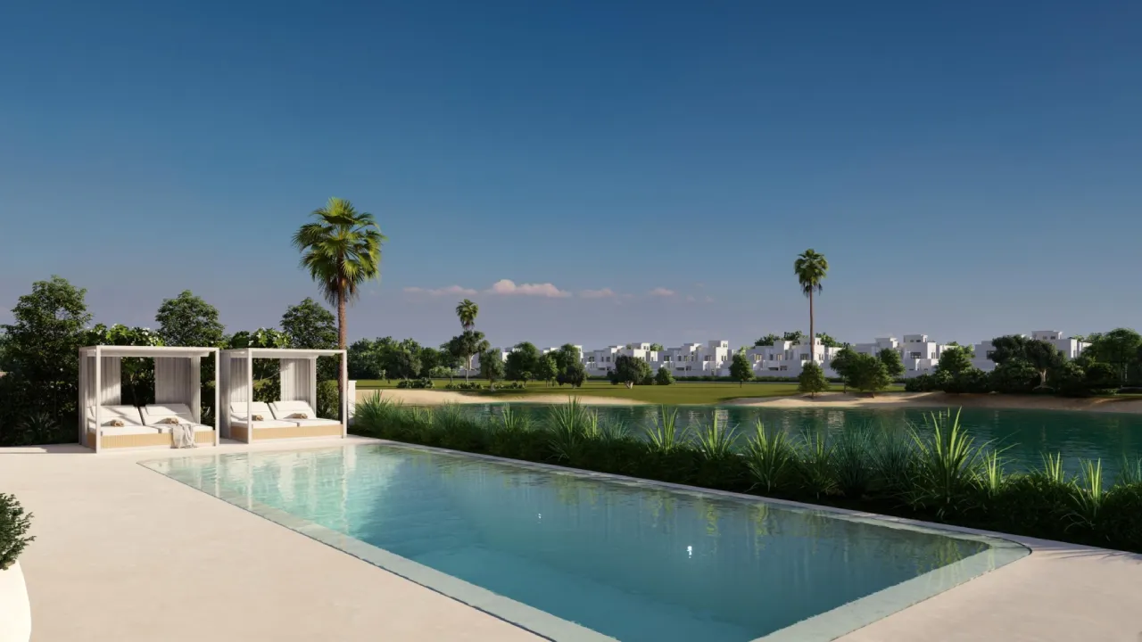 Long swimming pool design for a Jumeirah Islands house with cabana beds, lake view, palms and clean pale paving
