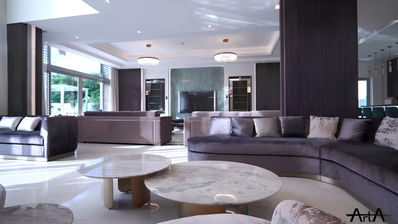Luxury living room in a District One villa renovation in Dubai with large sofas, marble coffee tables, dark feature walls, and modern ceiling lighting