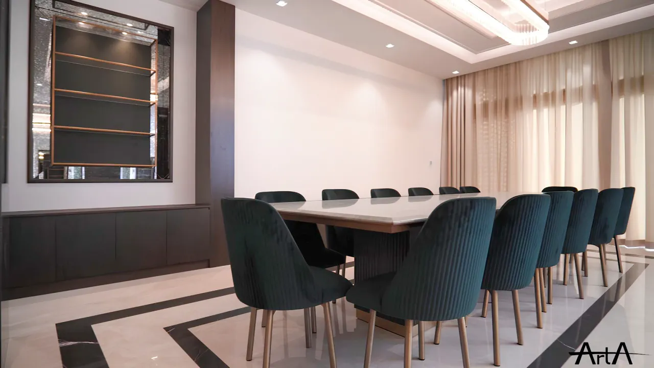Dining room in a District One villa renovation in Dubai with long dining table, dark green chairs, feature lighting, curtains, and polished flooring
