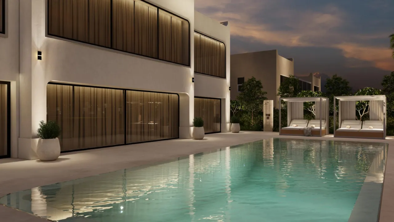 Evening luxury villa pool with large swimming pool, cabanas, warm lighting, water reflections, and outdoor seating