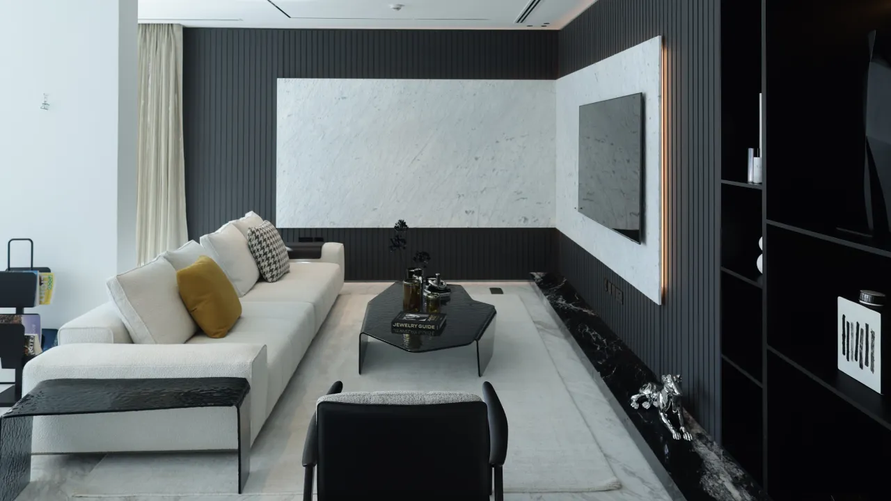 TV lounge after house renovation in Palm Jumeirah with black ribbed wall panels, white marble surround, pale sofa, and dark shelving
