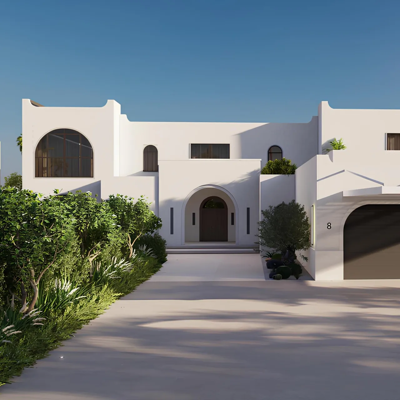 Luxury modern Mediterranean house exterior in Dubai with white facade, arched entrance, black-framed windows, warm wood door, garden beds, palms, and driveway approach.