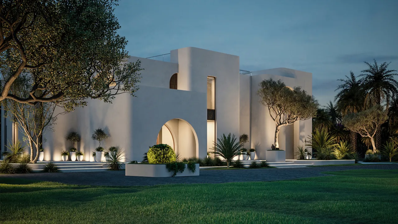 Modern white Mediterranean luxury villa in Dubai with arched entrance, warm exterior lighting, manicured lawn, mature trees, palms, and landscaped garden at dusk.