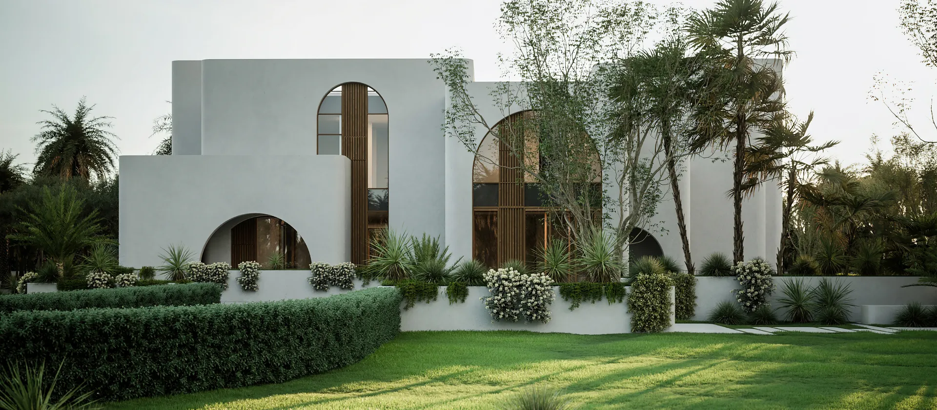 Contemporary Villa Landscape Design with Layered Planting and Lawn Contemporary white villa with curved windows, layered hedges, palms, flowering plants, sculptural greenery, and a broad landscaped lawn.