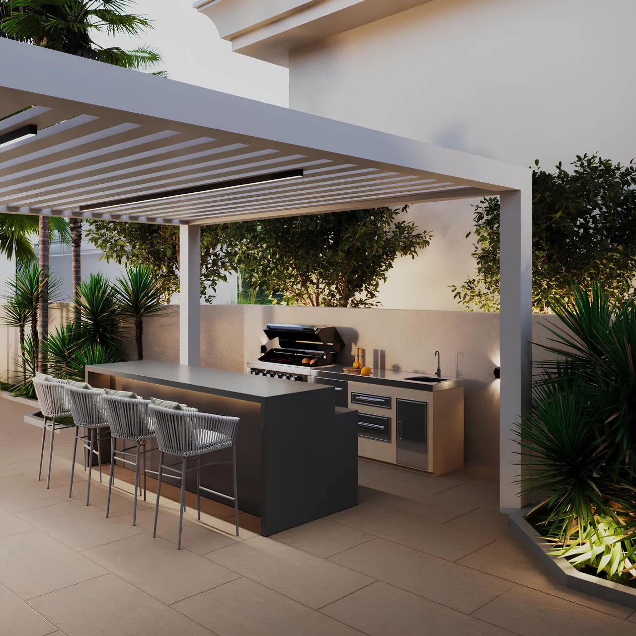 Modern covered outdoor kitchen with a bar counter, grill, seating, slatted pergola, and layered soft landscape planting with palms, shrubs, and warm garden lighting.