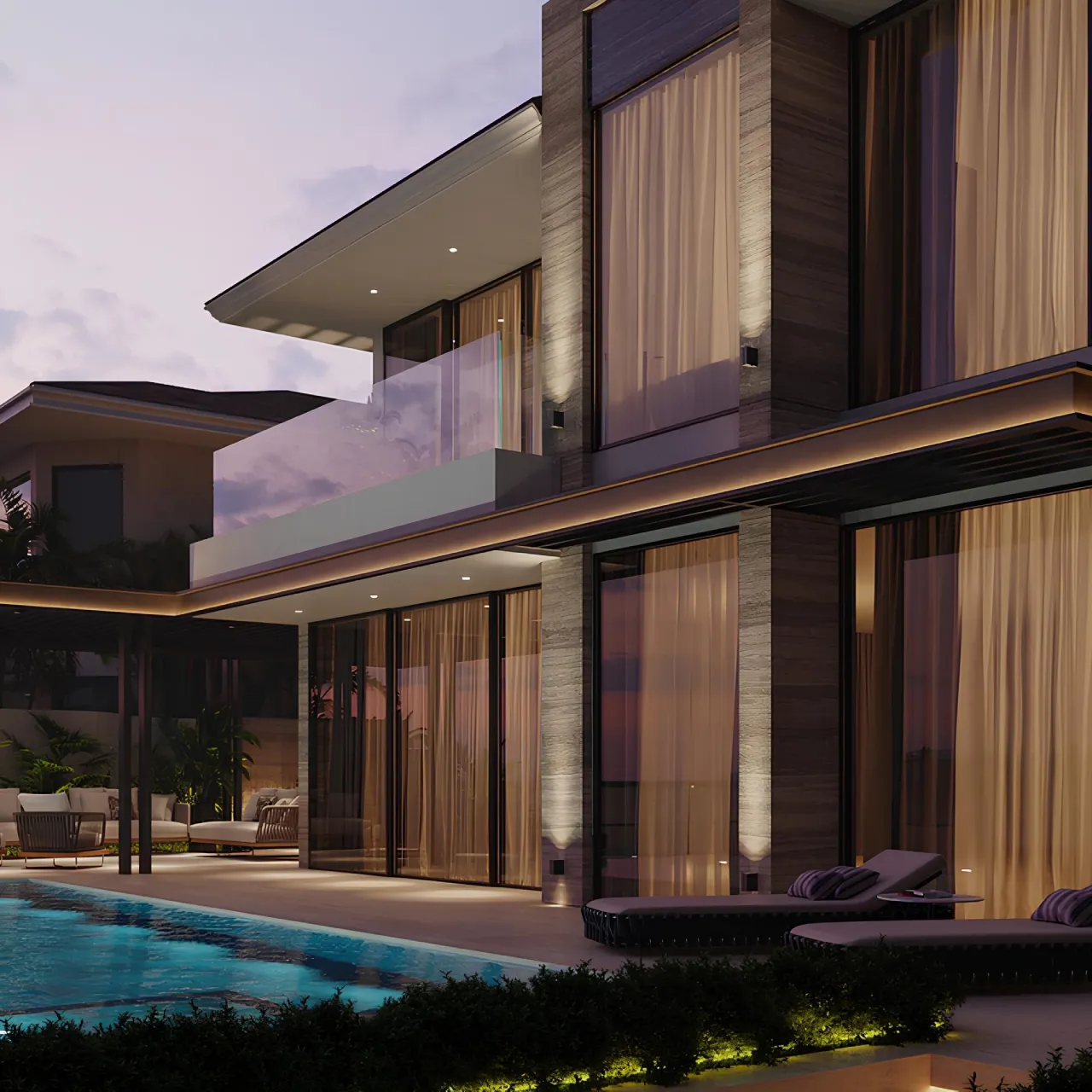 A modern renovated villa at dusk with poolside terrace, garden planting, trees, lounge chairs, exterior lighting, and landscaping around the outdoor area.