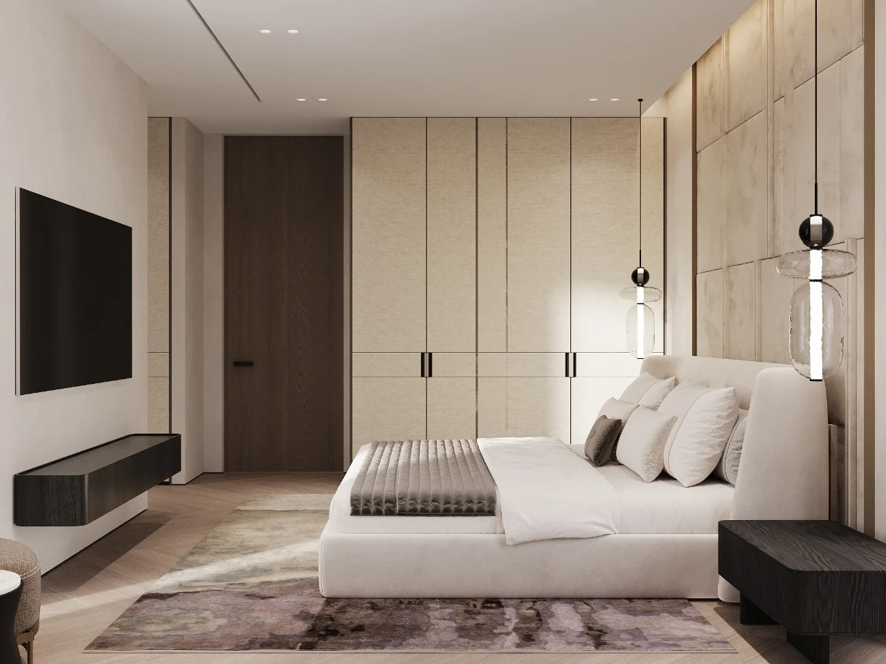 Modern bedroom with wide upholstered bed, white panel wall, dark bedding, built-in shelving, dark wood floor, side tables, and symmetrical layout.