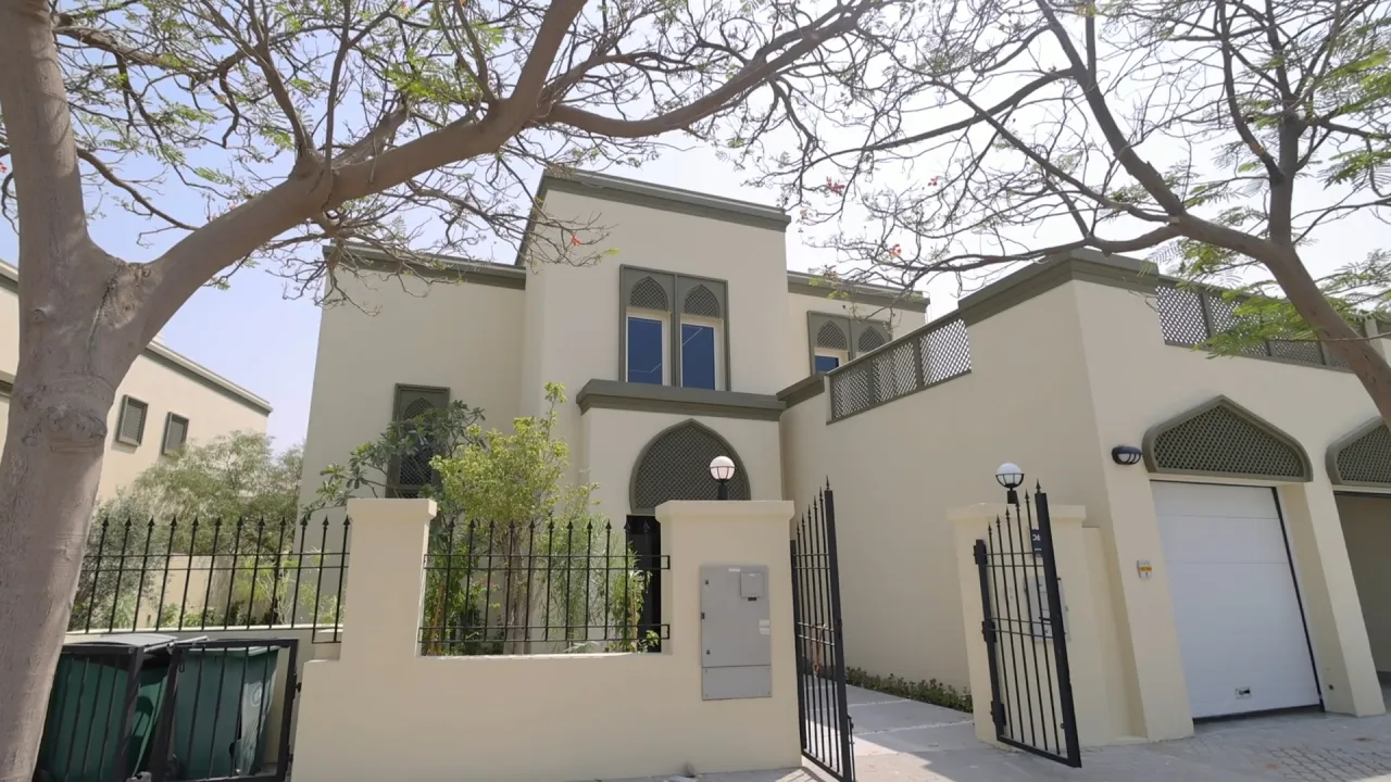 Renovated four-bedroom villa exterior in Jumeirah Park Dubai with pointed screens and double garage
