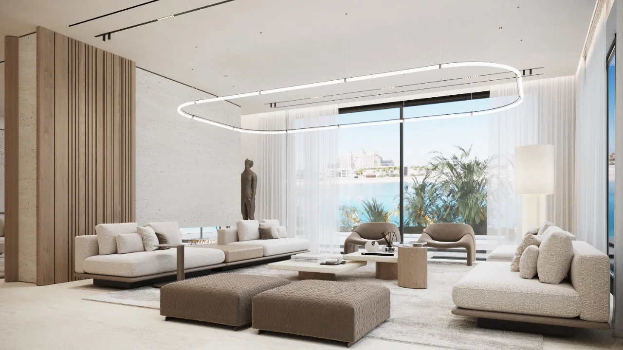 Waterfront contemporary living room interior design with cream sofas, loop chandelier, wood slat feature wall, sheer curtains, pale rug, sculptural seating, and water view