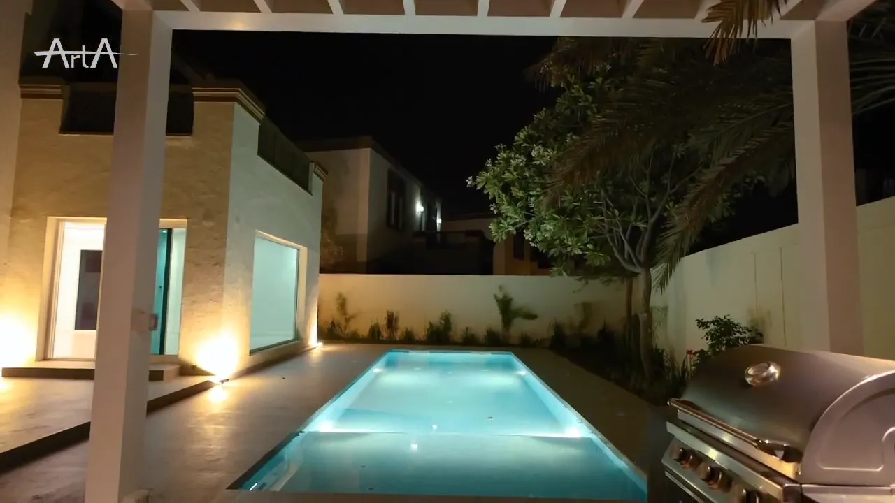 Night view from the pergola toward the completed swimming pool in Jumeirah Park