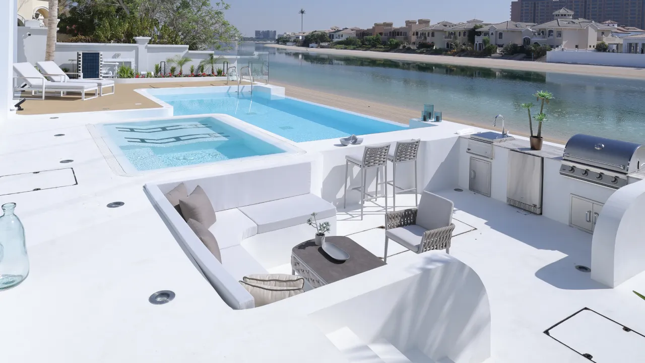 Palm Jumeirah swimming pool construction before and after with integrated spa and waterfront deck