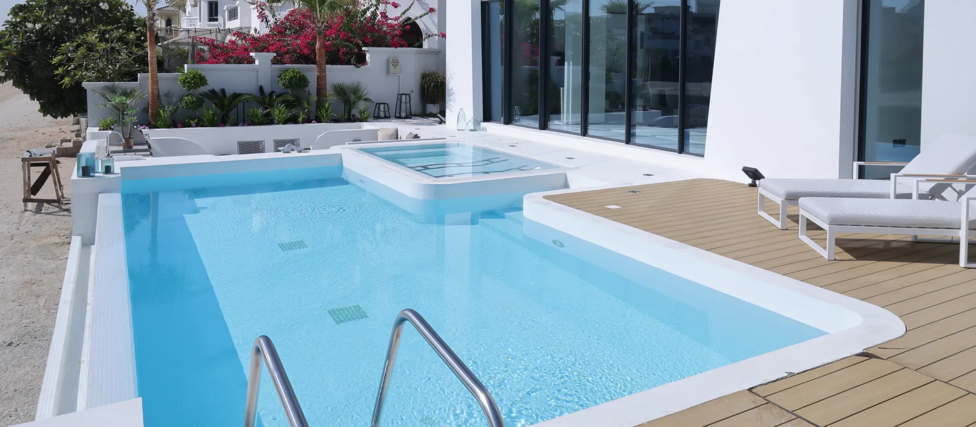 Before and after swimming pool construction at a Santa Fe Atrium Entry Garden Home on Palm Jumeirah Dubai