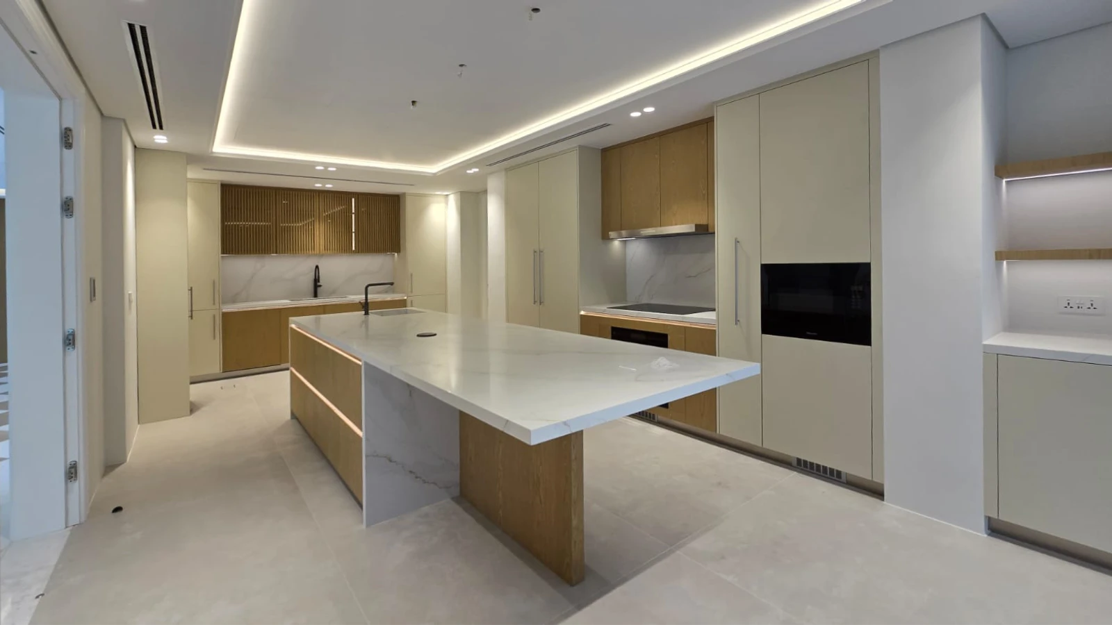 Meadows kitchen after renovation with long island and oak cabinetry by Arta