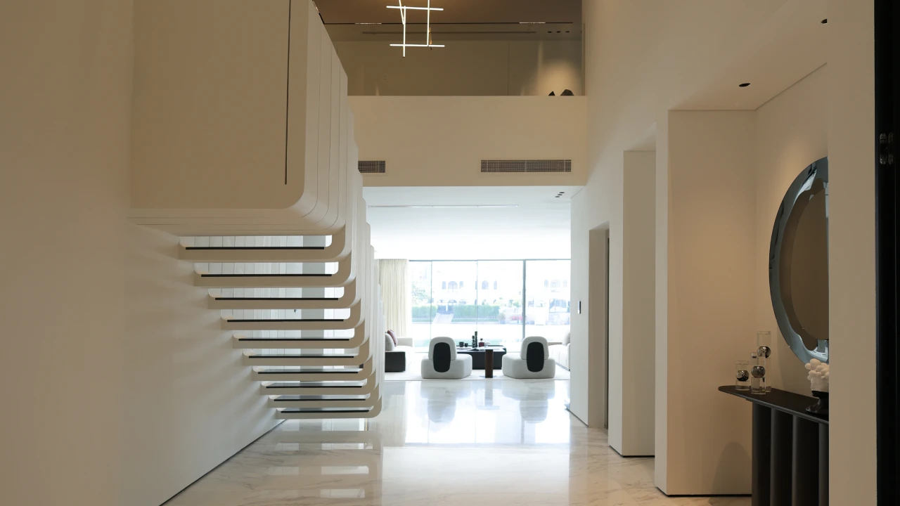Palm Jumeirah villa entrance after renovation with custom staircase by Arta